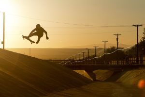 Skateboarder jump in air photo Max Dubler