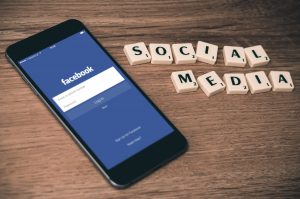 social media crosswords phone facebook on screen