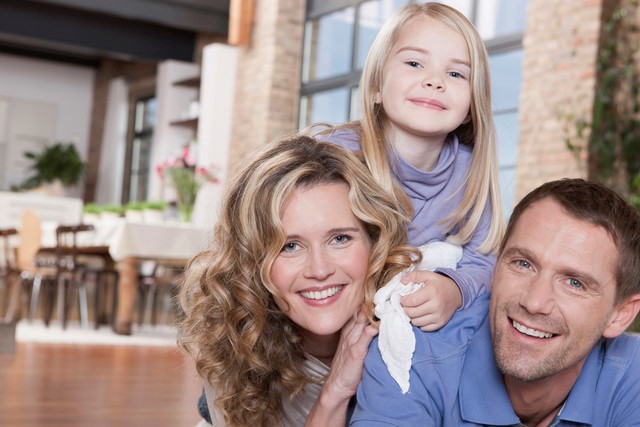 happy family parents and daughter