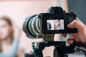 Selective Focus Of Beautiful Model On Camera Display In Photo Studio