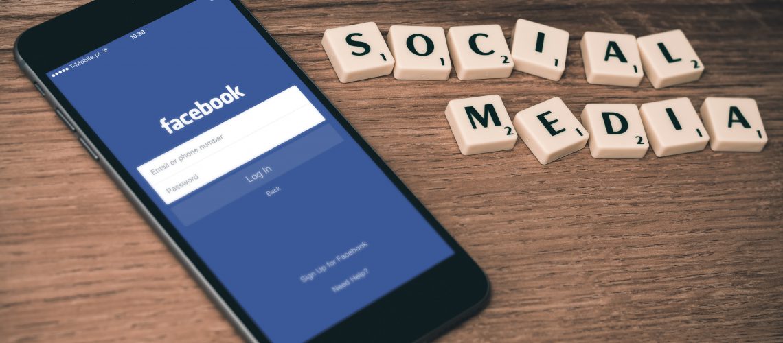 social media crosswords phone facebook on screen